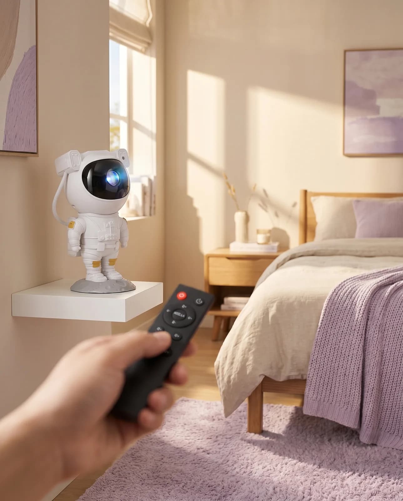 Hand pointing the remote control at the projector on a wall shelf